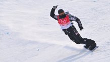 USA's Shaun White reacts after his run in the Snowboard Men's Halfpipe qualification run during the Beijing 2022 Winter Olympic Games at the Genting Snow Park H & S Stadium in Zhangjiakou on February 9, 2022.