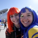 A Rams and Bengals fan poses