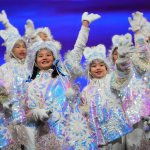 Children bearing snowflakes wave at the audience during the Closing Ceremony at the 2022 Winter Olympic Games, Feb. 20, 2022, in Beijing.