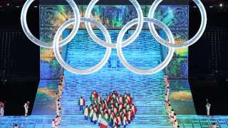 Flag bearer Michela Moioli of Team Italy carries their flag during the Opening Ceremony of the Beijing 2022 Winter Olympics at the Beijing National Stadium, Feb. 4, 2022 in Beijing, China.