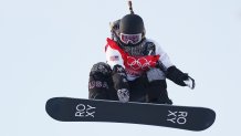 Chloe Kim of United States performs a trick on a practice run during the Women's Snowboard Cross Qualification on Day 5 of the 2022 Winter Olympics at Genting Snow Park on Feb. 9, 2022, in Zhangjiakou, China.