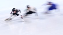 Kristen Santos of Team United States, Petra Jaszapati of Team Hungary and Cynthia Mascitto of Team Italy compete during the women's 1000m heats at the 2022 Winter Olympics, Feb. 9, 2022, in Beijing, China.