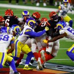 Joe Burrow #9 of the Cincinnati Bengals tries to avoid a sack