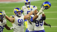 Aaron Donald #99 and Greg Gaines #91 of the Los Angeles Rams react