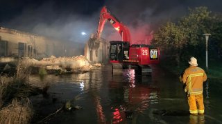 Firefighters at the scene of a fire on the site of the Los Angeles Poor Farm.