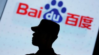 A security personnel stands guard at the opening session of Baidu’s annual AI developers conference Baidu Create 2019 in Beijing, China, July 3, 2019.