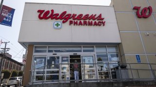 A person enters a Walgreens store in San Francisco, California, U.S., on Tuesday, April 13, 2021.