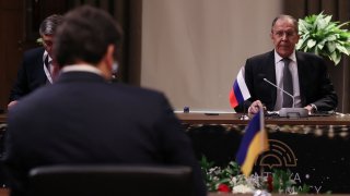 Russian Foreign Minister Sergei Lavrov, Ukrainian Foreign Minister Dmytro Kuleba and Turkish Foreign Minister Mevlut Cavusoglu (not pictured) attend their meeting in Antalya, Turkey March 10, 2022.