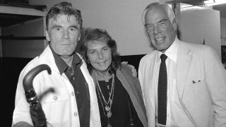 FILE – Actor Lee Marvin, right, and his wife, Pamela, visit with Mitchell Ryan, star of Arthur Miller’s play “The Price,” backstage at the Playhouse Theater in New York in July 1979.