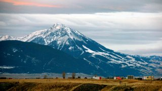 FILE - Emigrant Peak towers over the Paradise Valley in Montana north of Yellowstone National Park, on Nov. 21, 2016. Park County authorities said Friday, March 25, 2022, that a hiker was killed in the area in a suspected encounter with a grizzly bear.