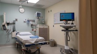 An empty bed in a room at the emergency department of Sharp Memorial Hospital in San Diego, California, U.S., on Thursday, Jan. 28, 2021.