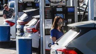 People at a gas station.