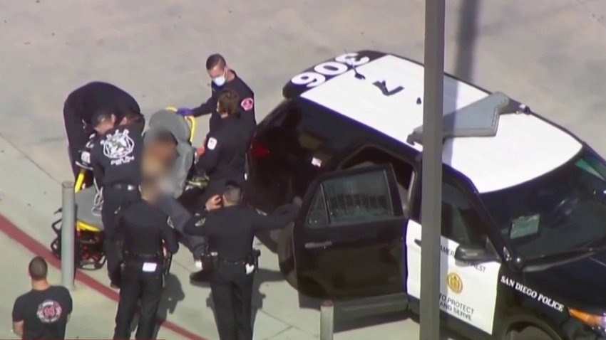 A student under arrest at Lincoln High School on March 15, 2022. Plice say he reached for a gun in his waistband and was shot with a beanbag round by officers.