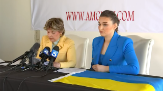 Veronika Didusenko, who was crowned Miss Ukraine in 2018, is pictured (right) at a March 8, 2022 news conference in Los Angeles.