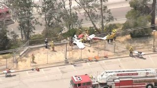 Firefighters at the scene of a plane crash in Sylmar.
