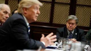 White House Chief Strategist Steve Bannon listens at right as President Donald Trump speaks during a meeting on cyber security in the Roosevelt Room of the White House in Washington, Tuesday, Jan. 31, 2017.