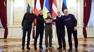 In this image provided by the Ukrainian Presidential Press Office, from left: Lithuania's President Gitanas Nauseda, Polish President Andrzej Duda, Ukrainian President Volodymyr Zelenskyy, Latvian President Egils Levits and Estonia's President Alar Karis pose for a picture during their meeting in Kyiv, Ukraine, Wednesday, April 13, 2022.