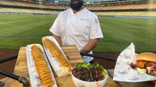 Senior sous chef standing in front of food