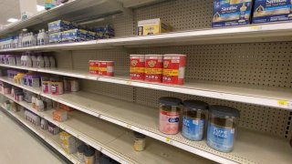Empty spaces on shelves of baby formula