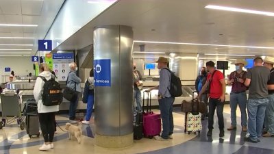 ‘We Are Not Out of the Woods With COVID': Experts Urge Masking Up When Traveling
