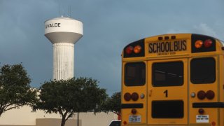 A school bus is parked outside the SSGT Willie de Leon Civic Center, where the community has gathered in the wake of a mass shooting at Robb Elementary School on May 24, 2022 in Uvalde, Texas.