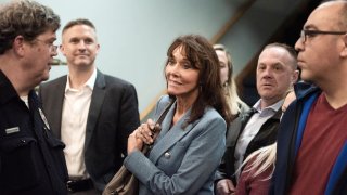 Diane Hendricks enters the room where Blackwater founder Erik Prince was supposed to speak before the event was disrupted by protesting students Wednesday, March 27, 2019, at Beloit College in Beloit, Wis.