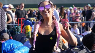 People queue for entry on the first day of the Glastonbury Festival at Worthy Farm in Somerset, England