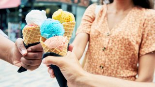 People cheers their ice cream together