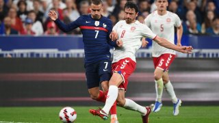 France's forward Antoine Griezmann (L) fights for the ball with Denmark's midfielder Thomas Delaney during the UEFA Nations League - League A Group 1 first leg football match between France and Denmark at the Stade de France in Saint-Denis, north of Paris, on June 3, 2022.