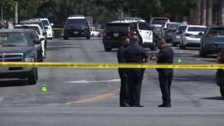 Police at the scene of a deadly shooting in Koreatown.