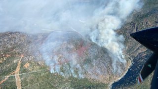 Smoke rises from the Rices Fire in the Sierra Nevada.