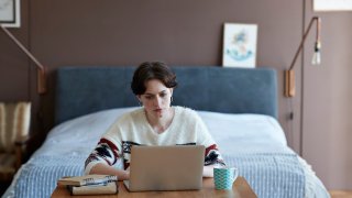 How to Work From Your Bedroom Without Ruining Your Sleep, According to Experts