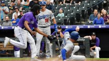 Los Angeles Dodgers first baseman Freddie Freeman #5 slides into home plate in a game against the Colorado Rockies at Coors Field on Thursday, July 28, 2022.