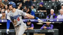 Los Angeles Dodgers shortstop Trea Turner #6 hits a three-run double in a game against the Colorado Rockies at Coors Field on Thursday, July 28, 2022.