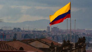 Colombian flag with view of down town Bogota