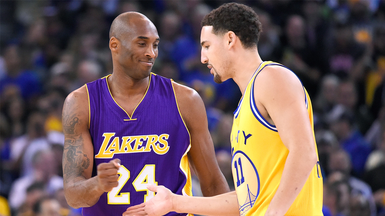 Kobe Bryant signs game-worn jersey for Klay Thompson