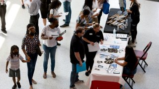 People attend the Mega Job Fair held at the FLA Live Arena on June 23, 2022 in Sunrise, Florida.