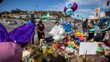 Candles, balloons, and flowers have been left at the site of a deadly crash in Windsor Hills.