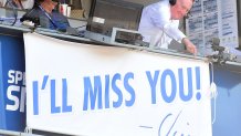 LOS ANGELES, CA - SEPTEMBER 25: Los Angeles Dodgers announcer Vin Scully points to the sign as he receives an applause during the seventh inning stretch against the Colorado Rockies at Dodger Stadium on September 25, 2016 in Los Angeles, California. Scully will be retiring after 67 years of service to the Dodgers. (Photo by Harry How/Getty Images)