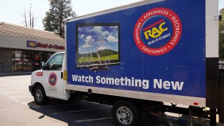 A Rent-A-Center delivery truck is seen in Sacramento, Calif., Aug. 2, 2022.