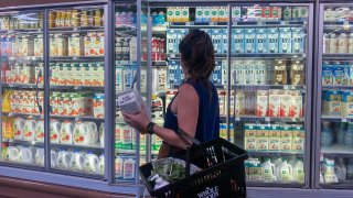 A woman shops for oat milk at a supermarket in Santa Monica, California, on September 13, 2022.