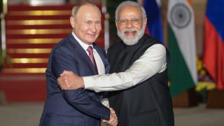 Narendra Modi, India’s prime minister, right, and Vladimir Putin, Russia’s president, pose for photographs as Putin arrives at Hyderabad House in New Delhi, India, on Monday, Dec. 6, 2021. India and Russia have a longstanding friendship, said one analyst. However, this friendship will be undergirded by India’s military dependence.