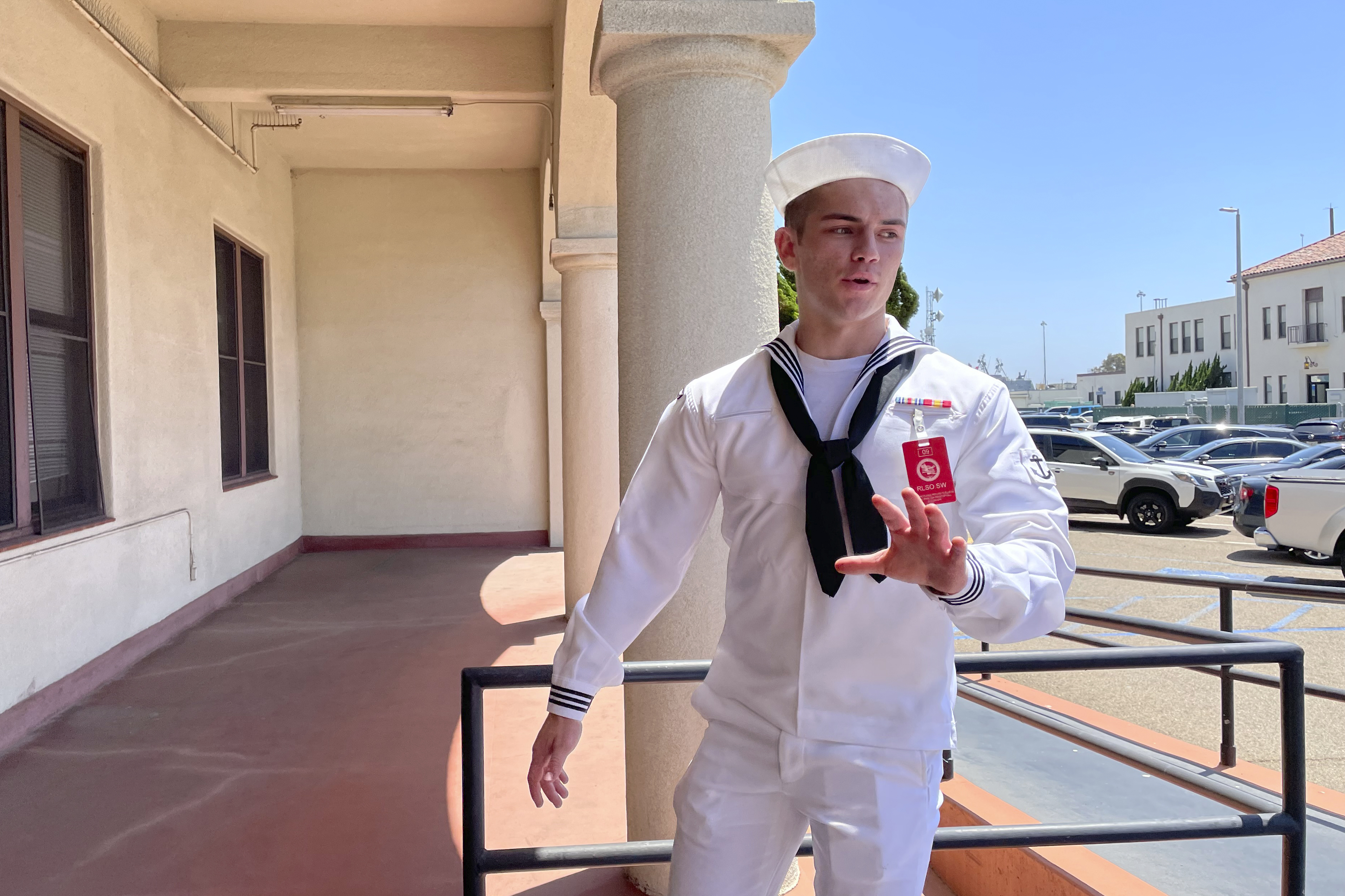 U.S. Navy sailor Ryan Sawyer Mays walks past reporters at Naval Base San Diego before entering a Navy courtroom, Aug. 17, 2022, in San Diego. Mays is accused of setting the USS Bonhomme Richard on fire.