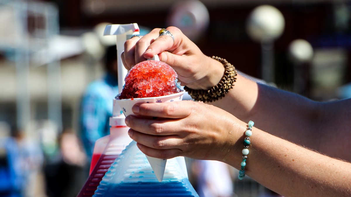 Families enjoying food and treats at an outdoor summer festival