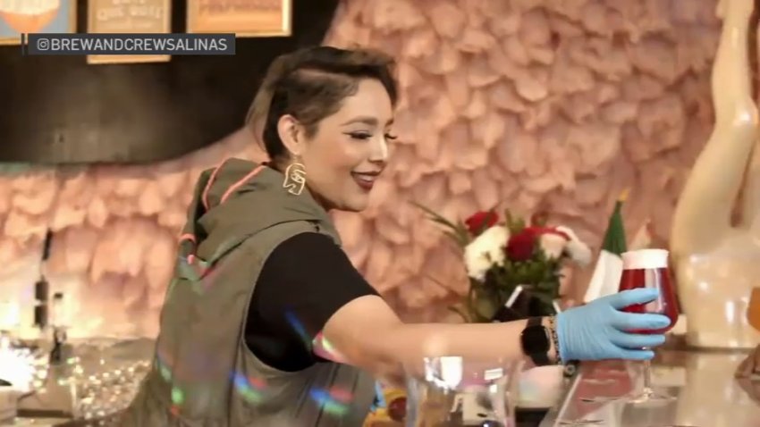 Marlene Garcia serves beer at her brewery in Salinas.