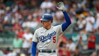 Los Angeles Dodgers first baseman Freddie Freeman (5) acknowledges the crowd before an at bat against the Atlanta Braves in the first inning at Truist Park.