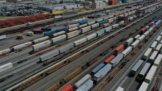 An aerial view of shipping containers and freight railway trains ahead of a possible strike if there is no deal with the rail worker unions, at the BNSF Los Angeles Intermodal Facility rail yard in Los Angeles, California, September 15, 2022.