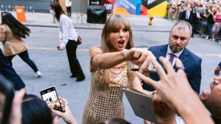 FILE - Taylor Swift greets fans