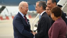 US President Joe Biden is greeted by LA mayor Eric Garcetti as he arrives at Los Angeles International Airport in California on October 12, 2022. (Photo by SAUL LOEB / AFP) (Photo by SAUL LOEB/AFP via Getty Images)
