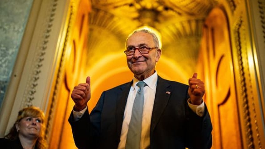 Senate Majority Leader Chuck Schumer (D-NY) gestures, walking out of the Senate Chamber, celebrating the passage of the Inflation Reduct Act at the U.S. Capitol on Sunday, Aug. 7, 2022 in Washington, DC. T